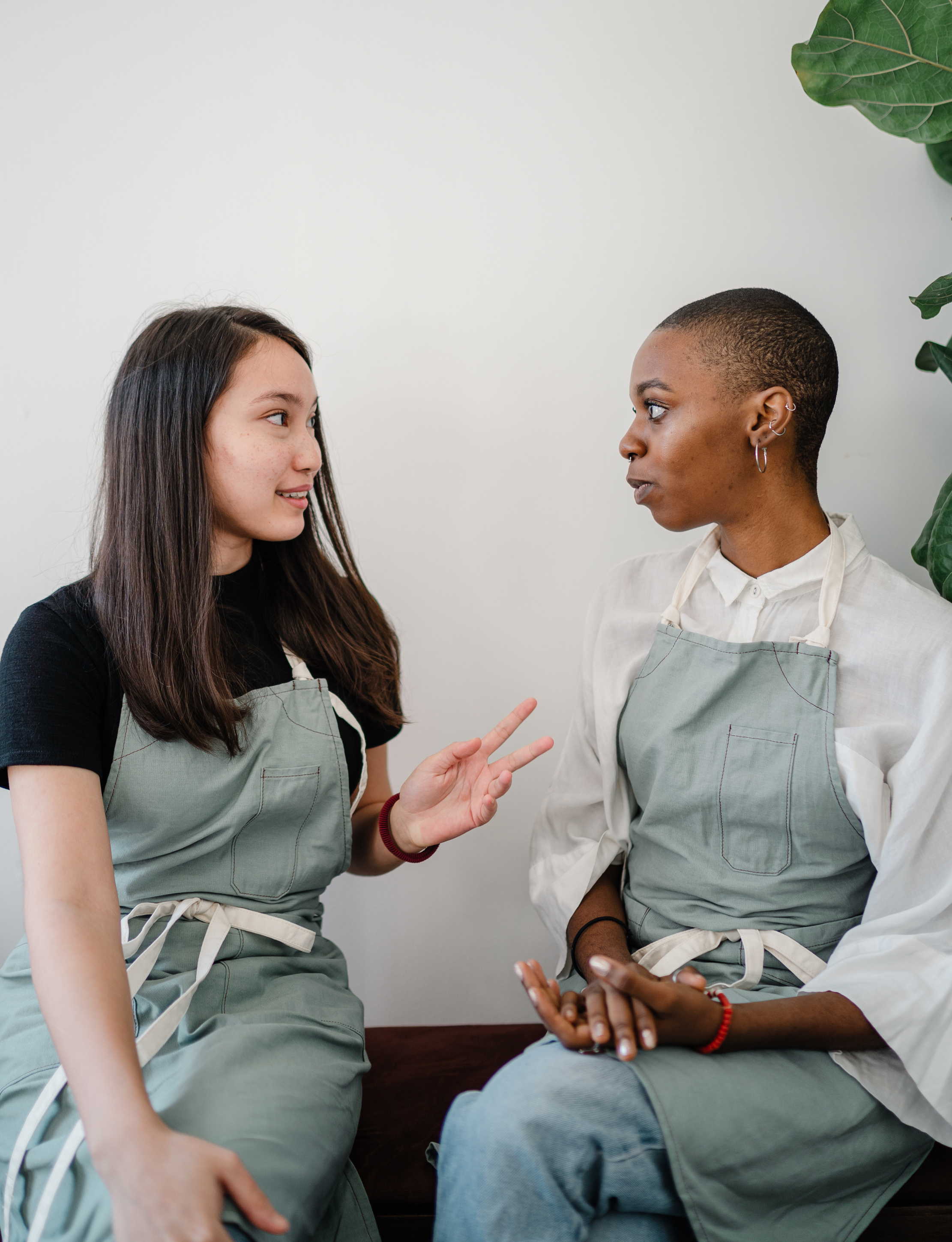 Photo of Two Women Talking to Each Other